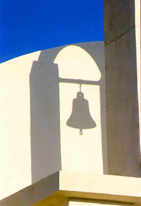cycladic style white church bells shadow