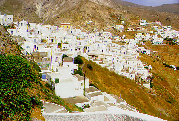 houses cling to the  on the mountain slope