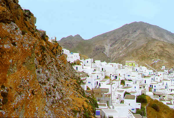 houses cling to the  on the mountain slope