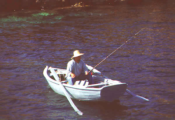 fisherman in dinghey