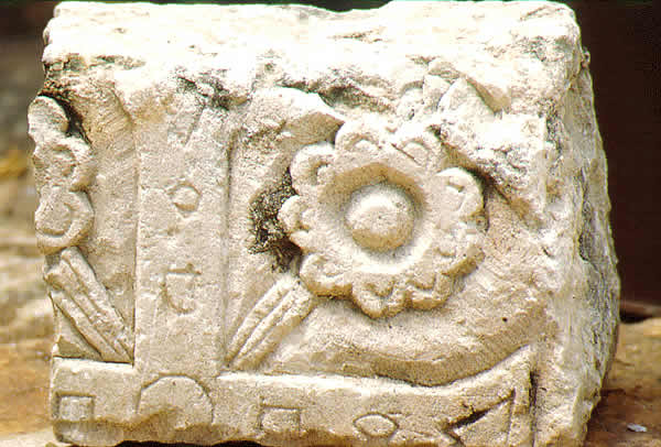 a stone carving relief cross