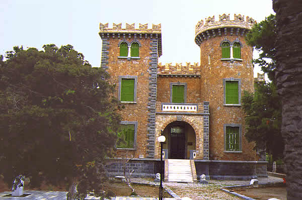 mansion with two different style turrets