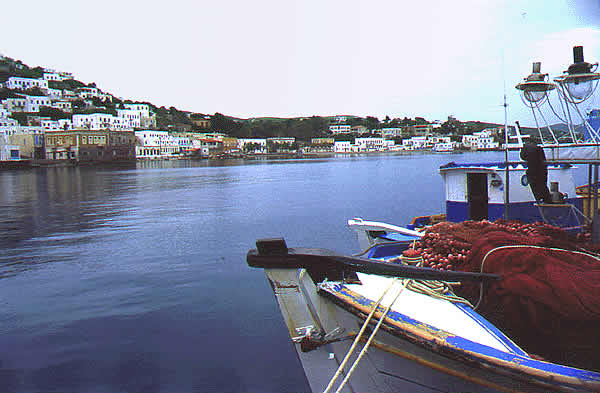 view of port with fishing boats and shops