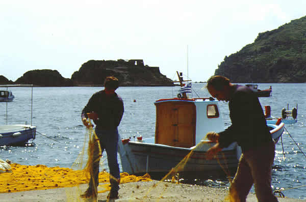 fishermen with nets at port