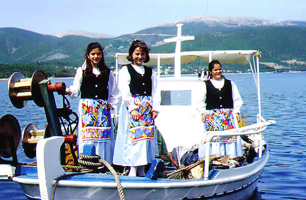  children in traditional costume on boat